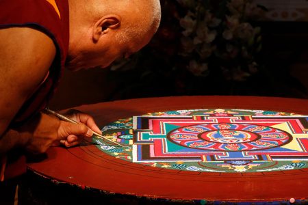 A monk making a mandala